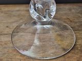 a glass of water sitting on a wooden table