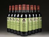 six bottles of red wine are lined up in a row