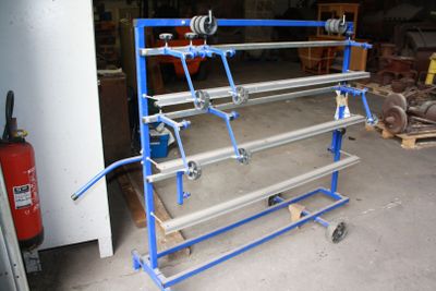 an image of a rack with a bunch of pipes
