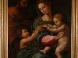 tableau représentant une femme tenant un enfant dans ses bras et un homme tenant un bébé