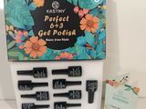 a box of black and white hair clips and a package of black and white hair clips