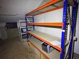 a room that has a shelf in it with a lot of shelves