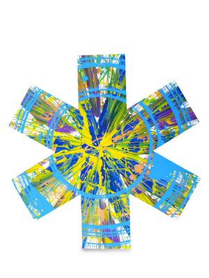 a close up of a flower made out of paper with blue and yellow paint