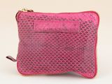 a close up of a pink purse on a white background