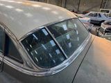 a car that is parked in a garage with other cars