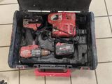 a tool box with tools in it on a tiled floor