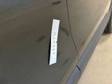 a sticker on the door of a car that says crazy