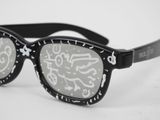 a pair of glasses that have graffiti on them