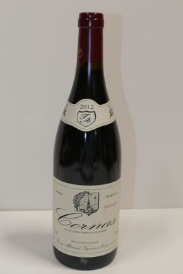 a bottle of wine that is sitting on a table