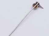a close up of a metal pin with a needle sticking out of it