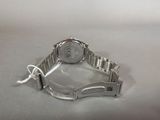 an image of a wrist watch on a table with a white background