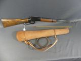 an old rifle and a gun are on a table