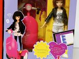 a box with a doll and a toy in it