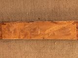 a piece of wood that has been carved into a piece of wood