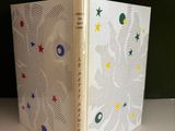 a picture of a book on a shelf in a room