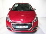 the red car is parked in a white room with a white floor