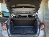 a car with its trunk open in a parking lot