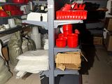 a shelf with many items on it in a room