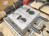 an image of a commercial deep fryer on a metal rack