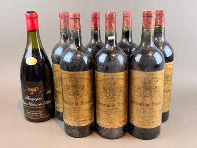 six bottles of red wine are lined up in a row