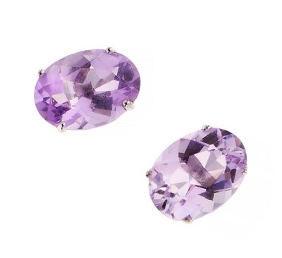 a pair of amethorate earrings on a white background