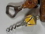 a bottle opener and a bottle opener with a face on it