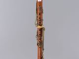 a clarinet with a wooden body and a black top