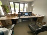 a desk with a chair and a computer on it