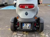 a small car that is parked in a parking lot