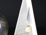 a bottle of perfume and a box of perfume on a table