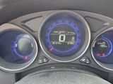 a close up of a car dashboard with various gauges