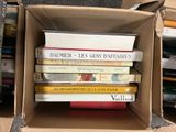 a box full of books sitting on a table