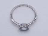 an image of a ring with a blue topaz stone