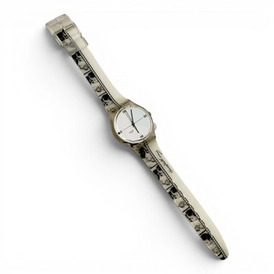 a watch that is sitting on top of a piece of paper