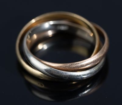 a close up of two rings on a black surface