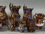 a lot of vases that are sitting on a table