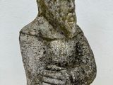 a statue of a man holding a baby in his arms