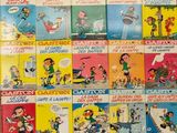a lot of children ' s books on the table