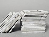 stack of magazines on grey background with copy space for text