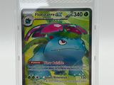 a close up of a pokemon card in a plastic case