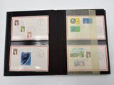 a black folder with four different stamps on it
