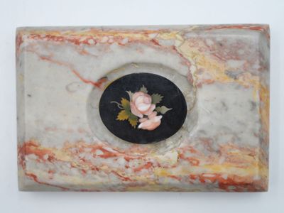 a picture of a marble box with a rose on it