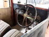a steering wheel and dashboard of an old car