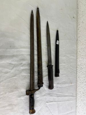 two knives on the table next to each other