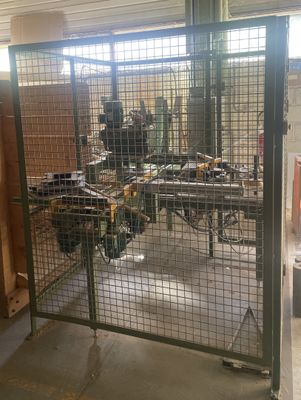 a picture of a large metal gate with a bunch of tools inside of it
