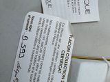 two tags on the back of a cell phone that are attached to the back of a cell phone