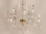 crystal chandelier with five lights in a white room