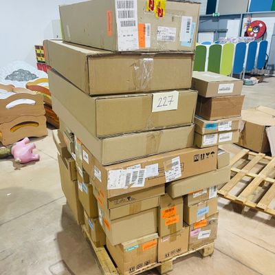 many boxes stacked on top of each other in a room