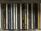 a shelf full of various cd ' s on a shelf