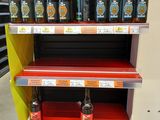 many bottles of beer on the shelves in the store